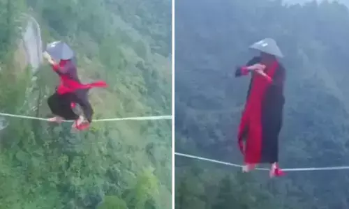 हजारों फीट की ऊंचाई पर रस्सी में चलता दिखा शख्स, स्टंट देख लोग हुए  दंग... देखें वीडियो