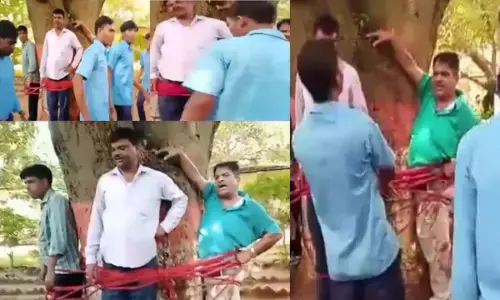 शिक्षक को पीटा: प्रैक्टिकल एग्जाम में कम नंबर आने पर छात्रों ने शिक्षक और दो स्टाफ को पेड़ से बांधकर पीटा, प्रिंसिपल सहित 11 पर केस
