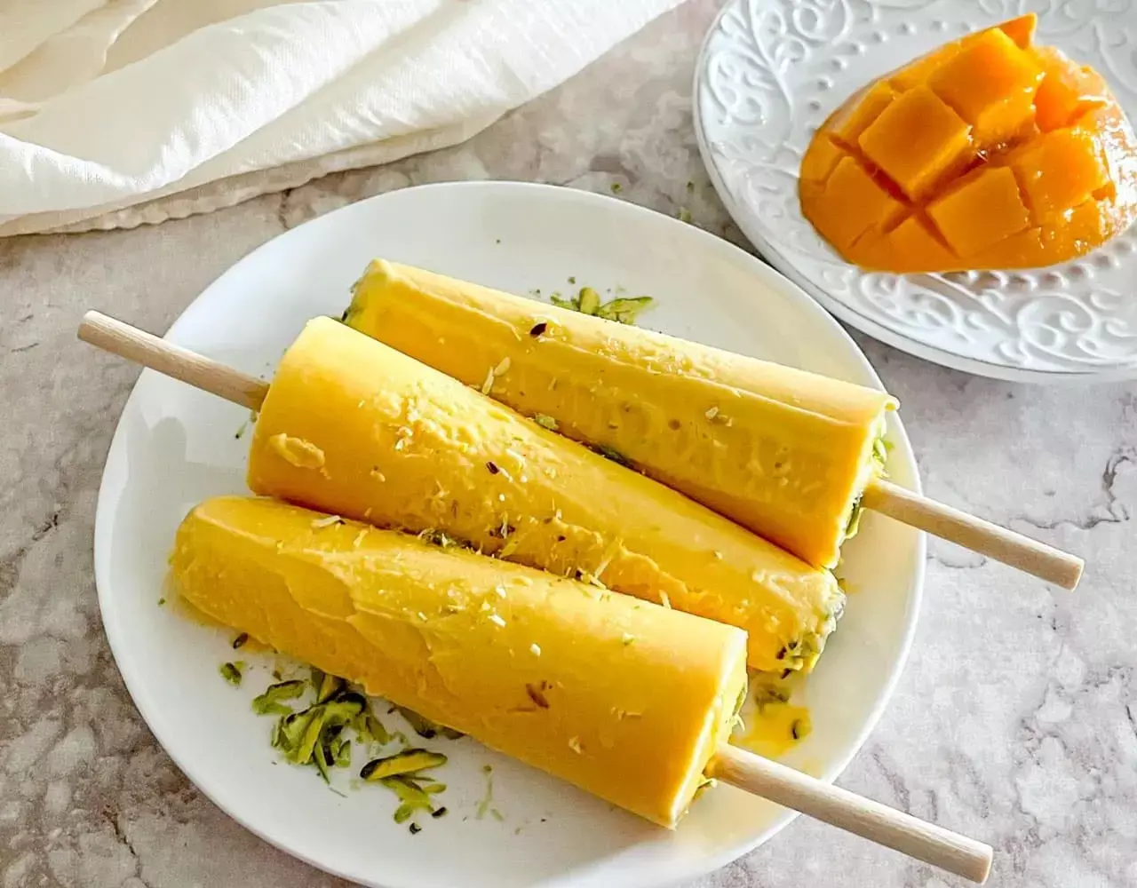 Mango Kulfi Recipe: घर में बनाइए एकदम स्मूद और टेस्टी मैंगो कुल्फी बेहद आसानी से, इस रेसिपी को फाॅलो करके...