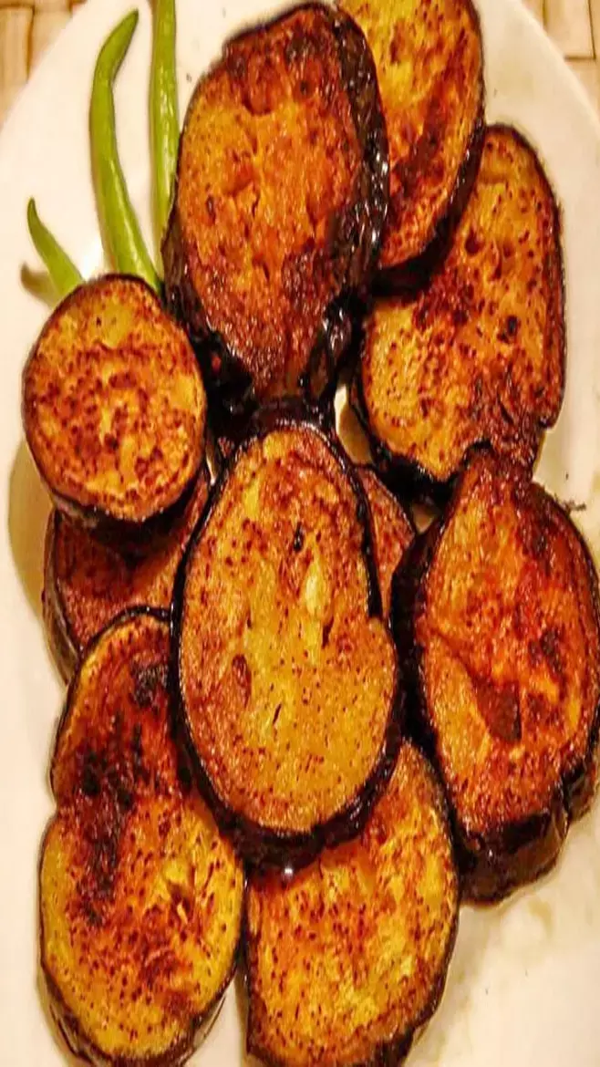 Baigan Ka Bhaja: दाल-चावल के साथ लगेगा जबरदस्त स्वाद, इस रेसिपी के साथ बनाइए बैंगन का भाजा, जानिए...